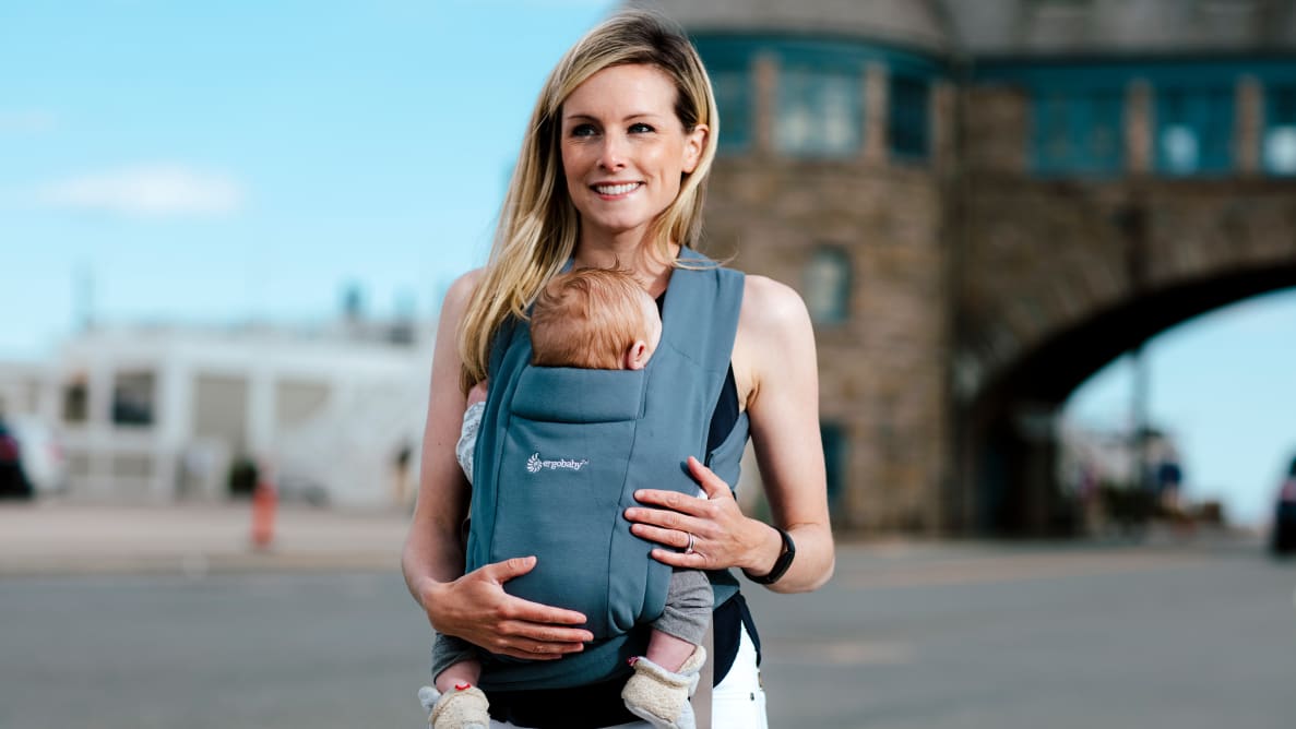 Woman with baby in baby carrier