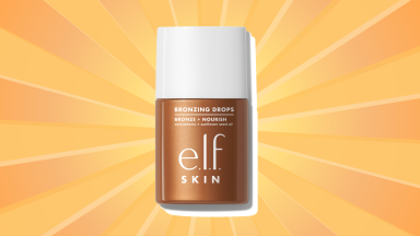 E.L.F. Cosmetics Bronzing Drops against a background of orange and yellow sunbeams.