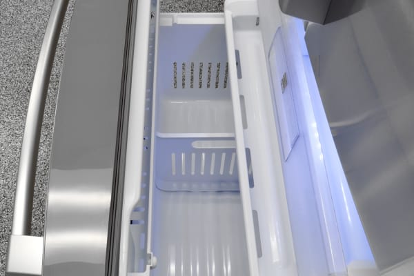 There's a short, shallow shelf just inside the Kenmore Pro 79993's freezer door, useful for keeping track of small or loose items like ice packs.