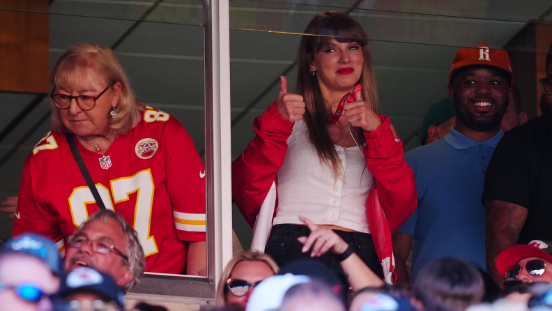 A photograph of Donna Kelce and Taylor Swift in the box at a stadium.