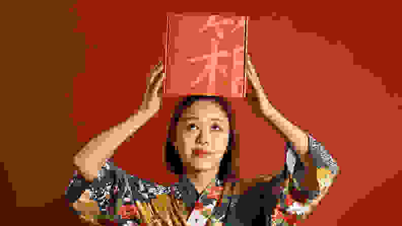 Woman holding box of Bokksu on her head