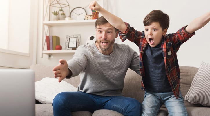 Dad and son watch sports