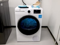A white ventless dryer sits next to a larger dryer in the Reviewed lab.