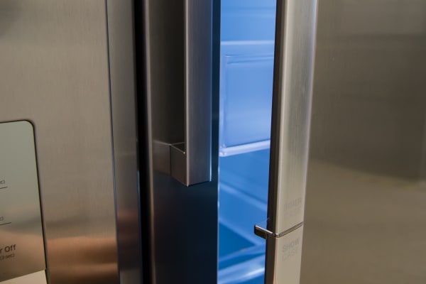 Door-in-door storage is accessed by pulling on the lower portion of the Samsung RH29H9000SR Food Showcase's divided fridge door.