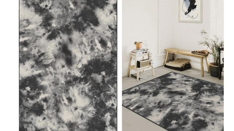 Two images of a black and white watercolor patterned rug