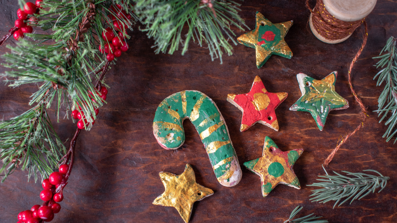Salt dough ornaments in star and candy cane designs, painted with red, green, and gold paint