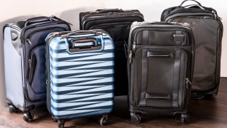 Osprey carry-on, Samsonite carry-on, and TravelPro carry-on next to each other