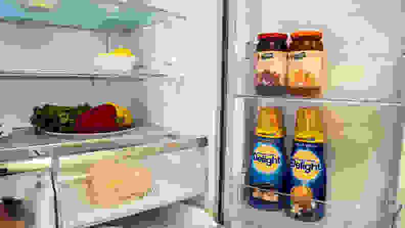 The right half of the Hisense HQD20058SV refrigerator's interior, with the right door open showing its internal storage compartments, stocked with items.