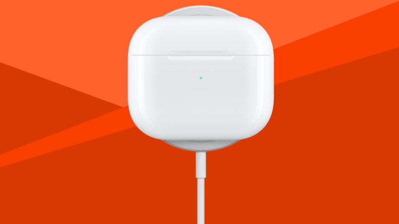 An Apple AirPods charger against a red background.