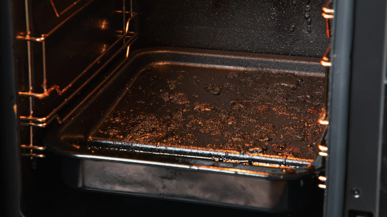 Caked-on food residue in the interior of the smoker