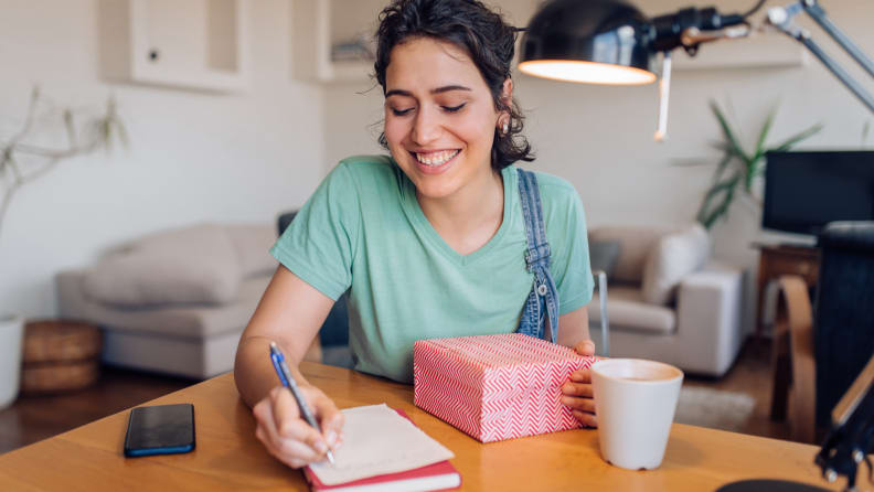 Woman putting together care package.