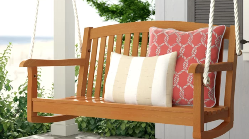 How quaint is this wooden porch swing?