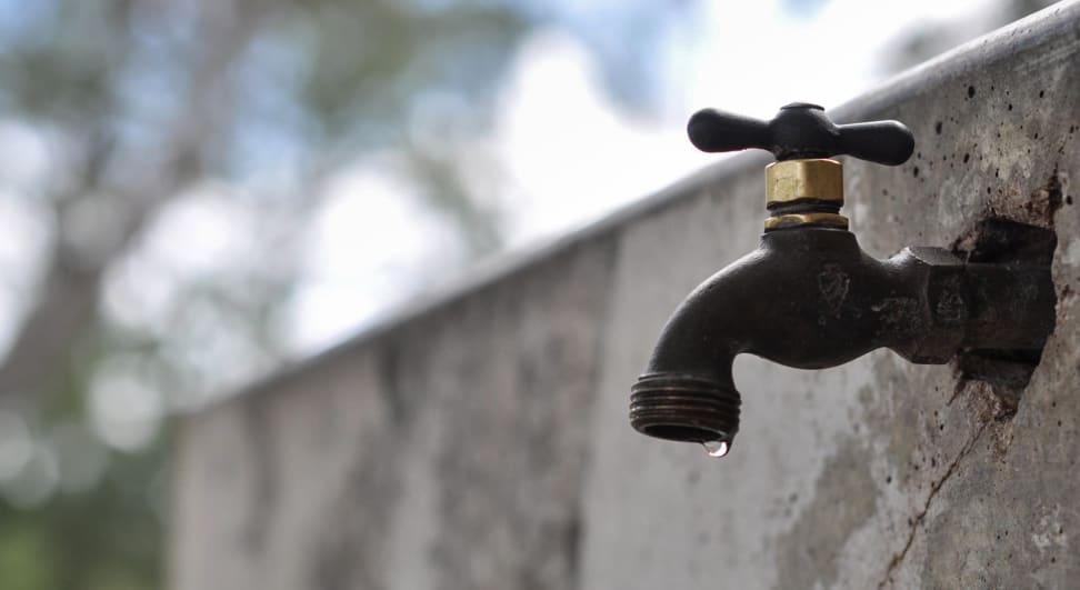 A dripping water faucet