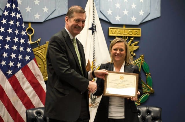 A U.S. Army representative and a Sony representative finalize a memorandum of agreement.