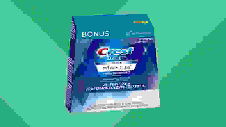 Box of Crest Whitestrips on green background