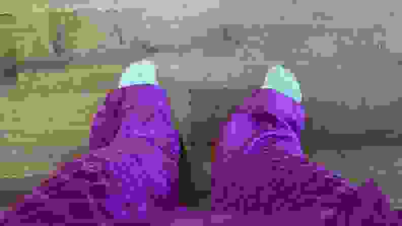 Man wearing baggy purple Savage X Satin Pants.