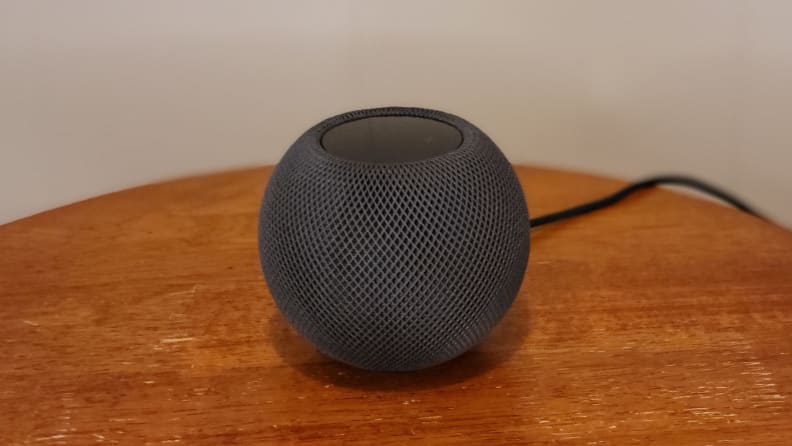 Apple's HomePod Mini smart speaker sits on a table