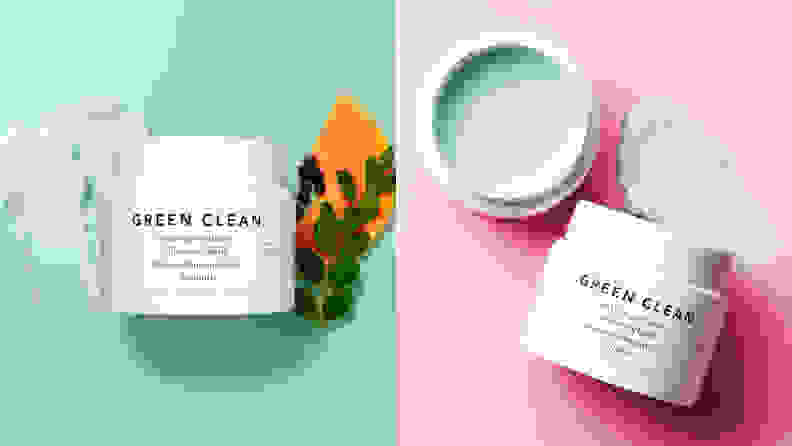 On the left: The Farmacy Green Clean Makeup Removing Cleansing Balm sits on a mint green background with a swatch of the cleanser to the left of the jar and a plant leaf to the right. On the right: Two jars of the Farmacy Green Clean Makeup Removing Cleansing Balm sit on a pink background. One of them is open to reveal a mint green formula.