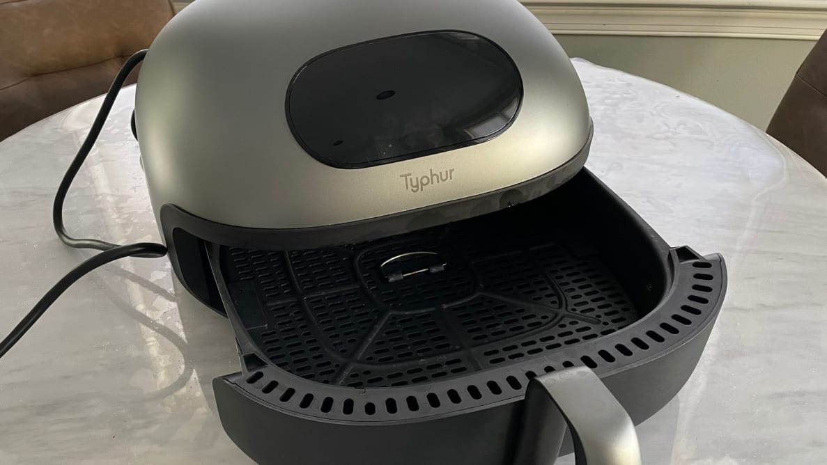 The Typhur Dome Air Fryer on a table.