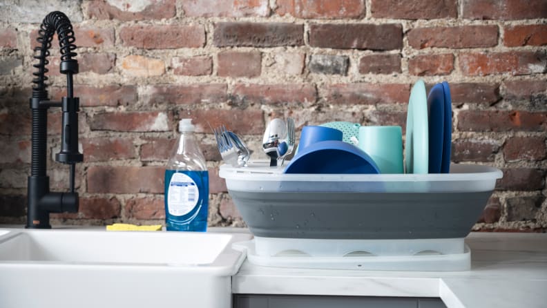 The Prepworks By Progressive dish rack is filled with drying dishes.