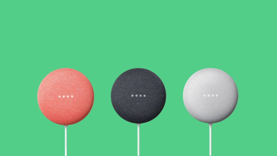 Three Google Nest Mini smart speakers (Gen Two) lined up together