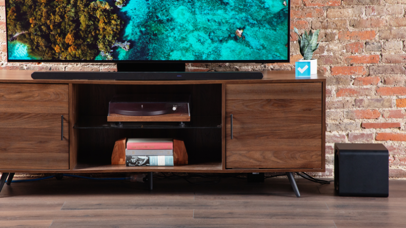 The soundbar set up in a TV table.