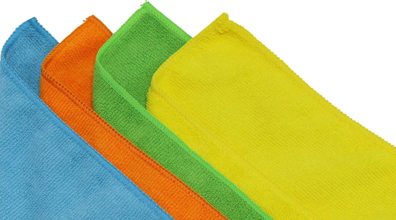 Several colors of cleaning cloths stacked