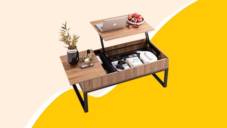 Wooden coffee table with hidden compartment and laptop on top.