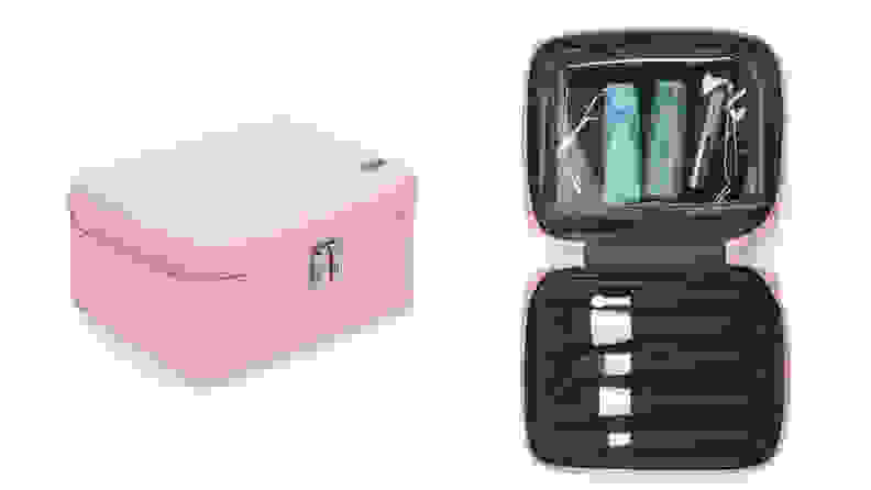 On the left: A pink Away cosmetic bag sits closed by its double zippers on a white background. On the right: The pink bag is opened to reveal a black interior with several makeup brushes in slots and toiletries in a pouch.