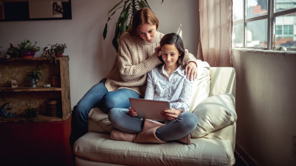 Mother and daughter using a tablet together