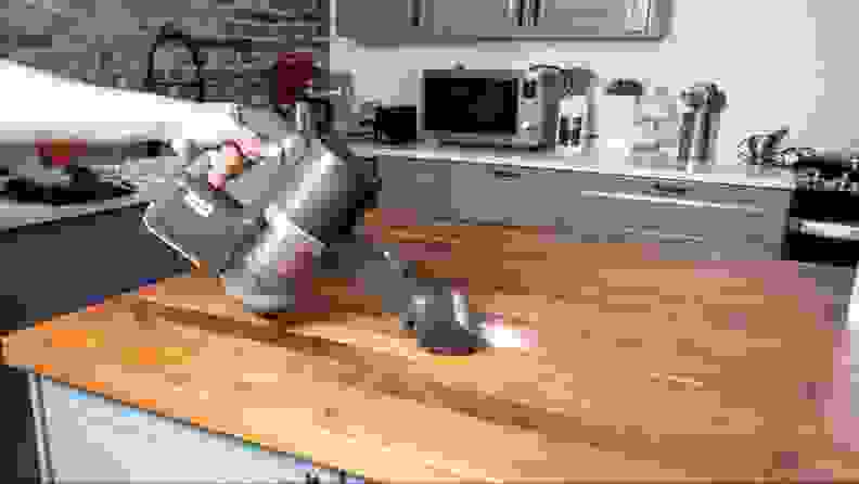 The LG Cordzero A949KTMS cleaning sugar off a countertop
