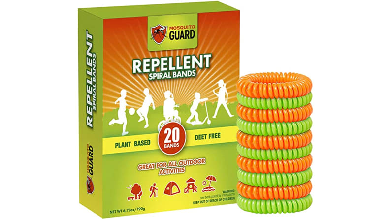 The Mosquito Guard bracelets, next to the box they come in. They look like the spiraled cord of a land line phone.