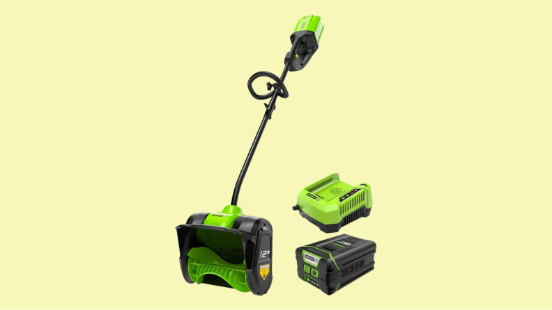 The Greenworks Pro shovel, alongside its battery and charger.
