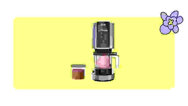 Ninja creami ice cream maker with a tub of ice cream on a yellow background