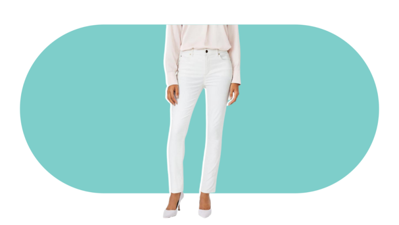 A model wearing the Ann Taylor Sculpting Pocket Mid Rise Skinny Jeans in white.