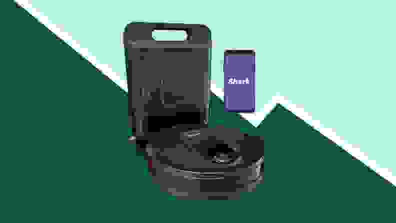 Image of robot vacuum against a green background
