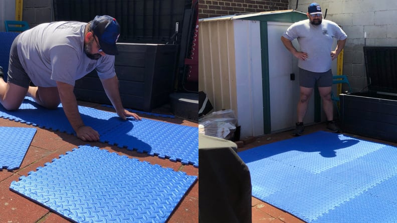 man putting together puzzle piece mat in backyard.