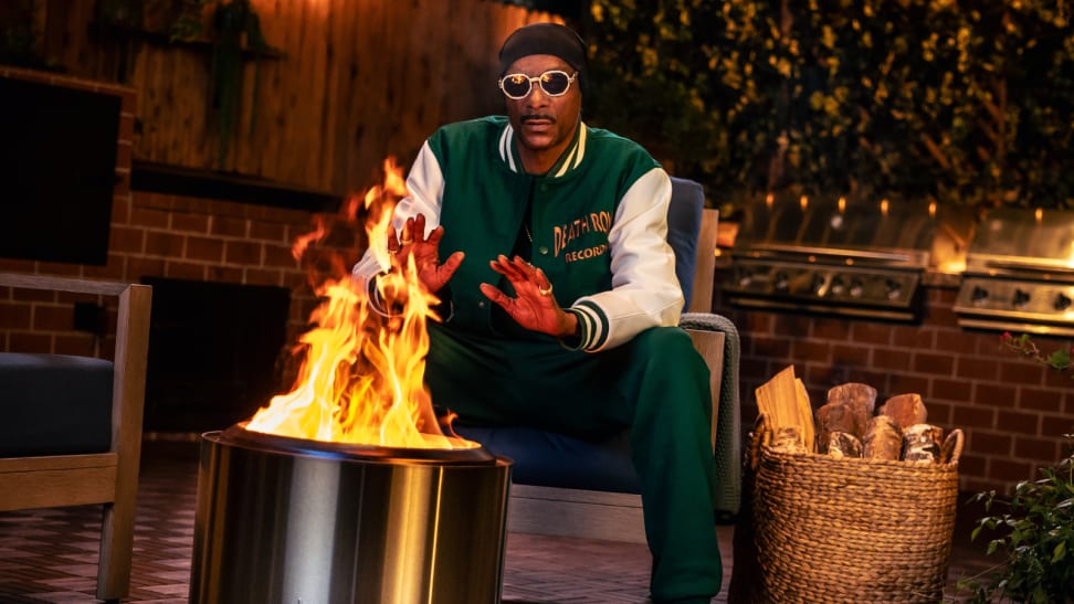 Snoop Dogg sitting next to Bonfire Solo Stove firepit