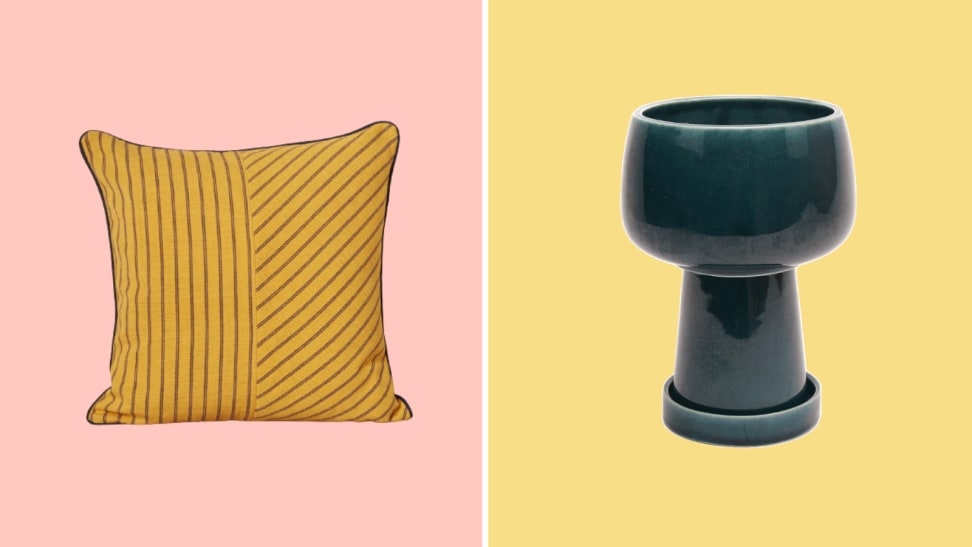 A yellow throw pillow against a pink background and a blue ceramic planter pot against a yellow background