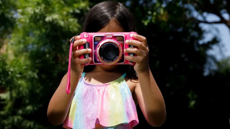 A child takes a photo with a KidiZoom camera