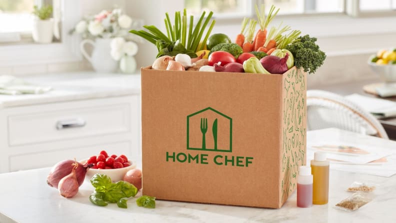A Home Chef meal kit box sits on a counter.