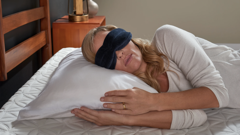 A sleeping woman wearing a sleep mask