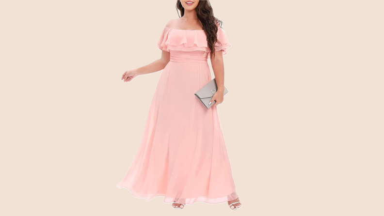 A model wearing an off-the-shoulder pink dress.