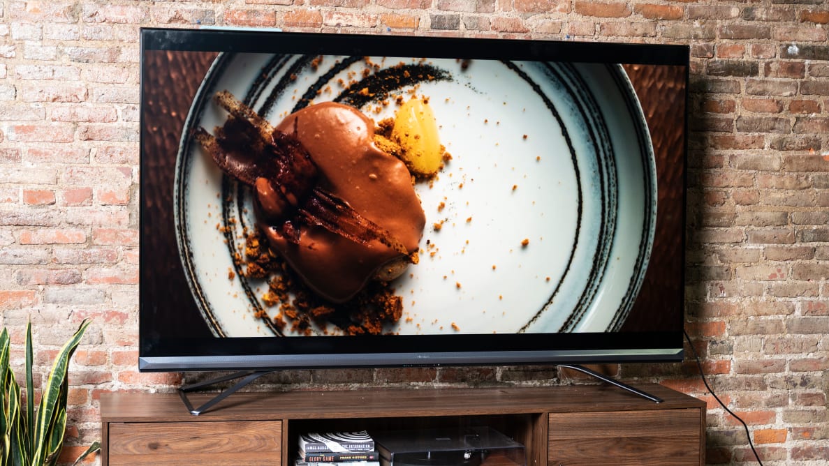 The 75-inch Hisense U9DG dual-cell TV displaying 4K/HDR content in a living room setting