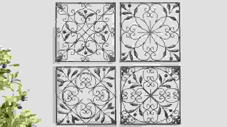 These wall decorations have a floral scrollwork motif.