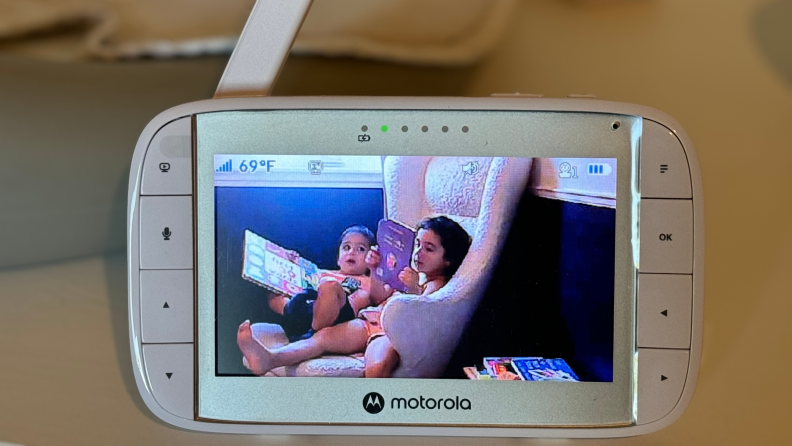 A child and baby on the Motorola VM36XL baby monitor camera.