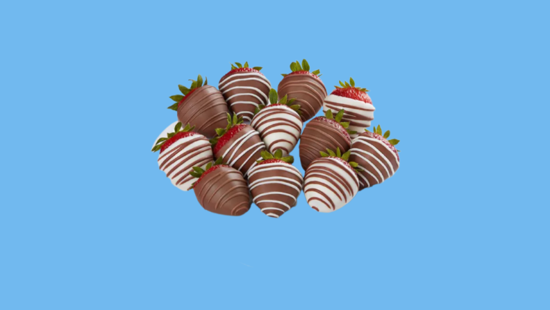 Bunch of chocolate-coated strawberries against blue background