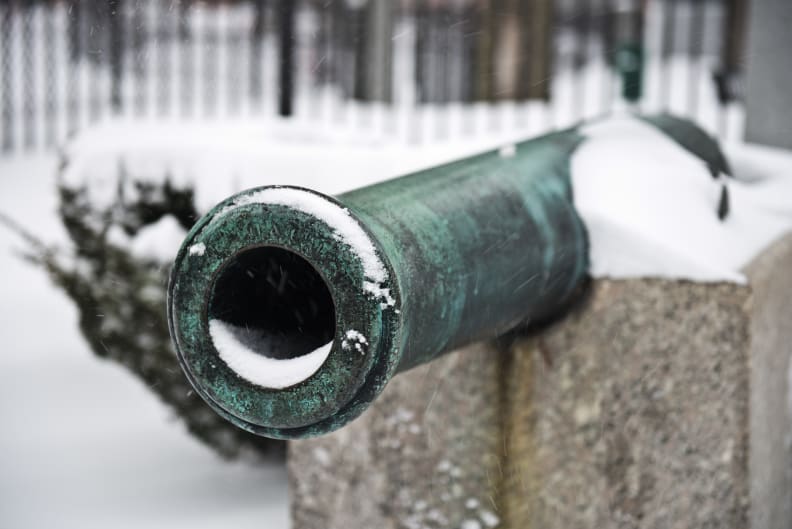 A photo of a decommissioned cannon taken during winter storm Juno.