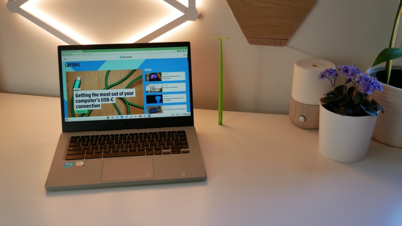 The Acer Chromebook Vero 514 on a white table, next to desk supplies.