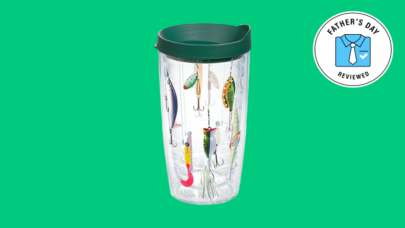 A Tervis Tumbler with fishing lure prints set against a forest green background.